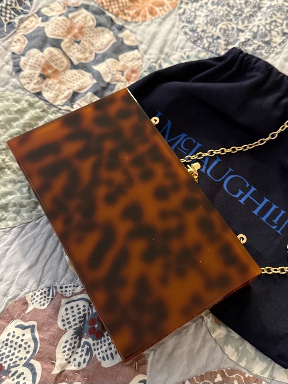 JMcLaughlin,Tortoiseshell Acrylic Clutch with Gold Chain
Unused in new condition